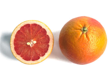 Closeup of red grapefruits on a white backgroundの写真素材