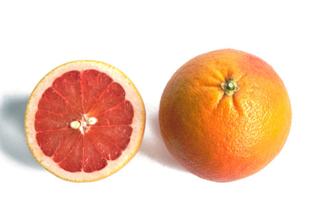 Closeup of red grapefruits on a white backgroundの写真素材
