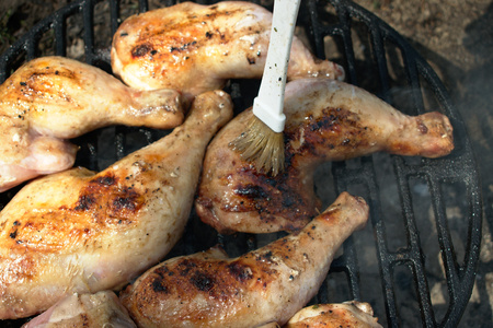 Closeup of chicken legs on the BBQの写真素材