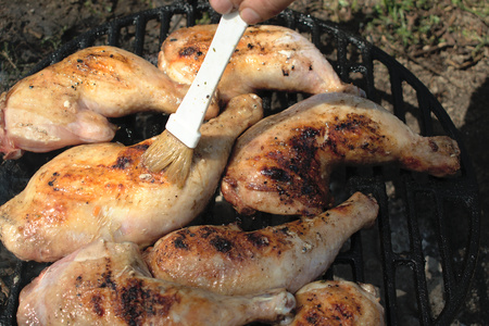 Closeup of chicken legs on the BBQの写真素材