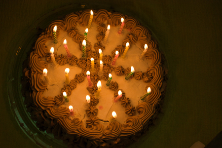 Birthday cake with lit candles