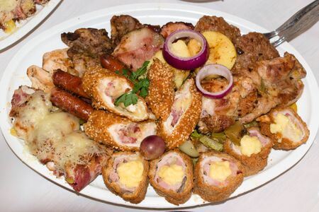Mixed meat and barbecue served on a plateの写真素材