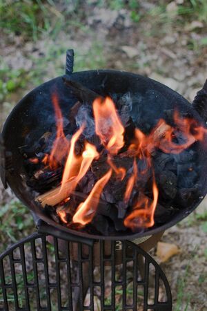 Closeup of fire from a BBQ grillの写真素材