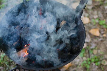 Closeup of smoke from a BBQ grill