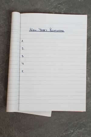 list of new year's resolutions in a notebookの写真素材