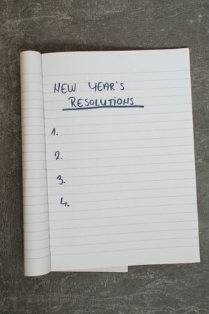list of new year's resolutions in a notebookの写真素材