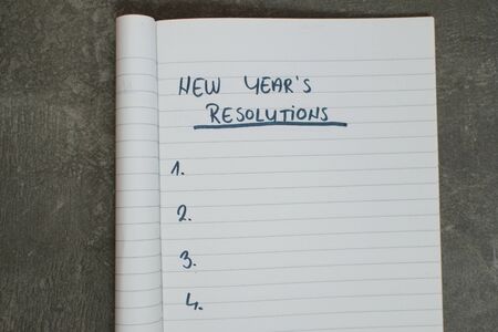list of new year's resolutions in a notebookの写真素材