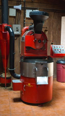 Big red industrial coffee roaster