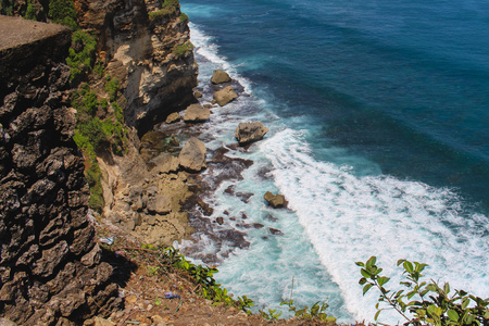Big sea waves seen from a high clif in Bali (Uluwatu)の写真素材