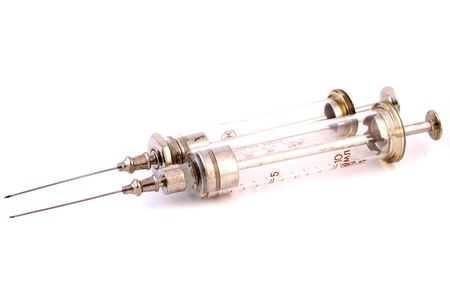 Two old syringes isolated against white backgroundの写真素材