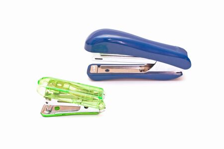 Staplers green blue isolated on white background