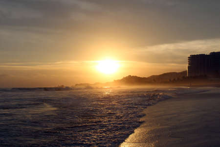Sun Hanging Over Beachの写真素材