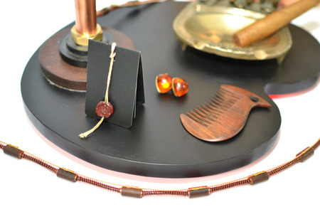 Ashtray with cigar, printing of wax and amber earringsの写真素材