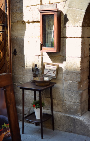 Vintage table with coffee beans on old streetの写真素材