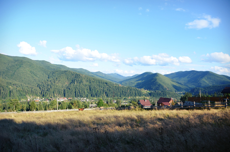 Stunning views of the village, mountains and fields before sunsetの写真素材