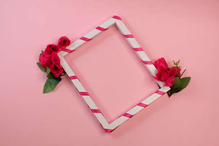 A frame with flowers on pinkの写真素材