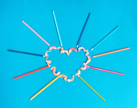 heart made of crayons, the concept of love.Turquoise backgroundの写真素材