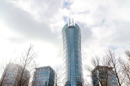 Glass skyscrapers of irregular shape. Bottom view. Abstract architectural detail of corporate...