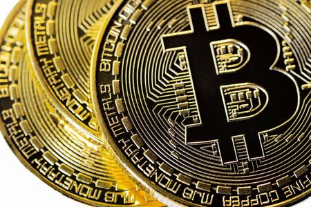 Closeup Golden Bitcoins. Photo virtual money. Blockchain technology, bitcoin mining concept.の写真素材