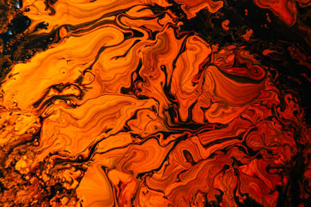 Background With Mixed Liquid Black And Orange Paints. Abstract Fluid Acrylic Painting. Marbled Colurful Abstract Background. Liquid Marble Pattern. Beautiful abstract background. Contemporary artの写真素材