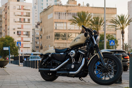 Netanya, Israel - May 16, 2023: Black motorcycle Harley-Davidson in the parking lot in the city on...