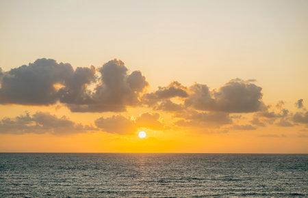 Bright beautiful sunrise or sunset at sea.の写真素材