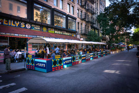 New York, NY / USA - September 19 2020: busy outdoor restaurant in East Village, Manhattan. Covid...
