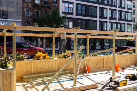 New York / USA - October 3 2020: Building an outdoor restaurant in downtown Manhattan. Covid outdoor...