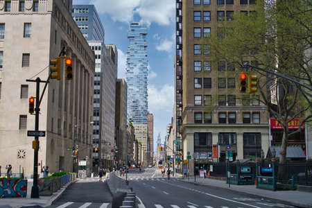 New York City street road in Manhattan at summer time. Urban big city life concept background