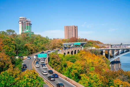 New York / USA - November 7 2020: The High Bridge with highway and colored trees during autumn...