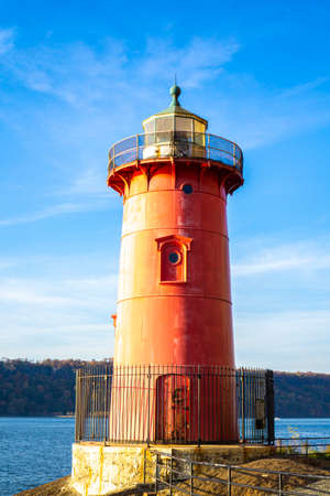 View of red lighthouse over Hudson River on a sunny dayの写真素材
