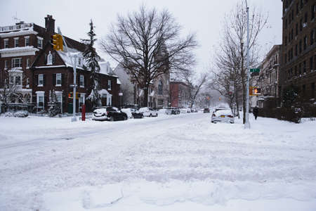 Winter scene with snow covered cars parked along streets in Brooklyn, NYの写真素材