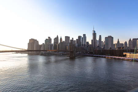 New York City skyline with skyscrapers at sunset. Downtown Manhattan known as Financial district...