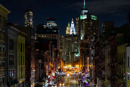 View of lower Manhattan, Chinatown and Financial district at night. Skyscrapers with lights on in New York Cityのeditorial素材