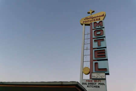 Hollywood, USA - August 10 2021: Signage of Hollywood Premier Hotel on a blue sky. Retro neon signのeditorial素材