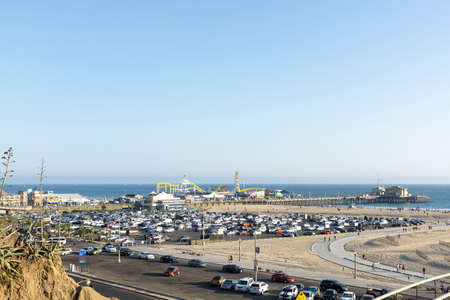Santa Monica, USA - 10 August 2021: Beach in Santa Monica with pier and parking lots