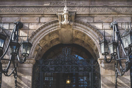 Boston, USA - October 22, 2021: Entrance to Boston Public Library with arched iron gate and decorative Victorian lampsのeditorial素材