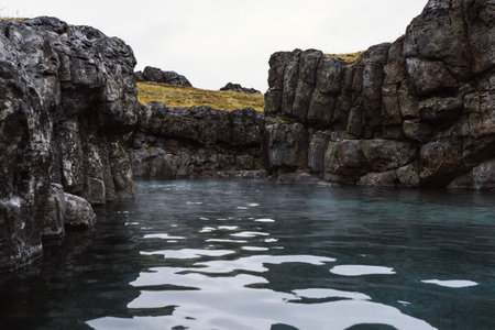 Sky Lagoon in Iceland. Geothermal spa with heated water on cold dayの写真素材