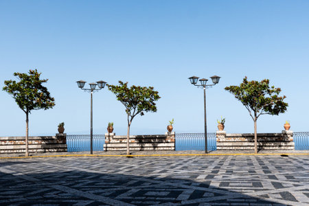 view from Castelmola, Sicily on Mediterranean Sea. Plaza or square with geometric sidewalkの写真素材