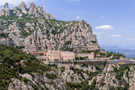 View of Santa Maria de Montserrat Abbey in the mountain of Montserrat near Barcelona in Catalonia, Spainの写真素材
