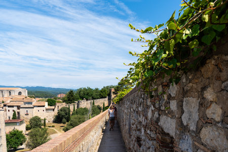 Landscape of Girona from the distance with mountains in the background on a nice day of summerの写真素材