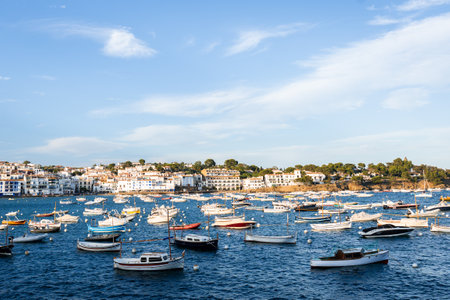 View of Cadaques, charming town in Catalonia, Spain. Mediterranean city on a bay with boats floatingの写真素材