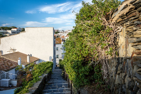 Stone stairs between the buildings in charming neighborhood of Cadaques, Spainの写真素材