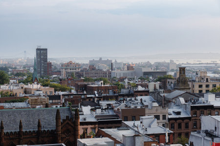 Cloudy sky over apartment buildings in NYC neighborhood of Brooklyn Heightsの写真素材
