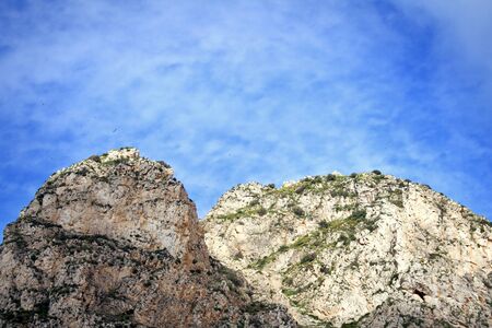 Mountain coast with sky and clouds backgroundの写真素材