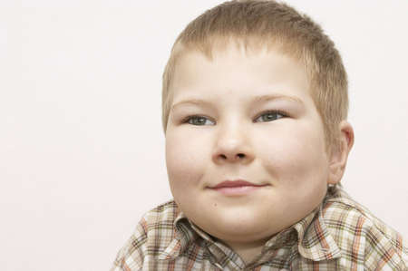portrait of a happy boy isolated on whiteの写真素材