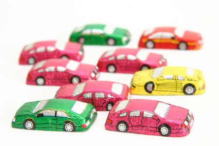 little chocolates in shape of car isolated on whiteの写真素材