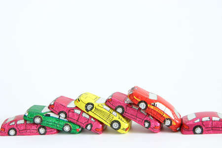 little chocolates in shape of car isolated on whiteの写真素材