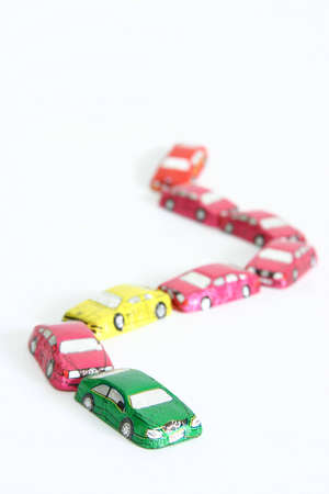 little chocolates in shape of car isolated on whiteの写真素材