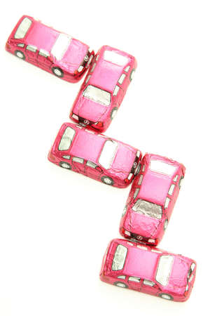 little chocolates in shape of car isolated on whiteの写真素材